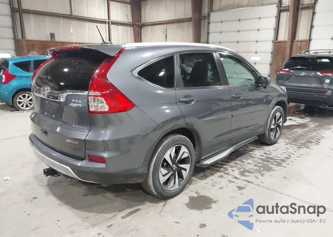 2016 Honda Cr-V Touring z USA, uszkodzony, nr VIN 5J6RM4H93GL125941
